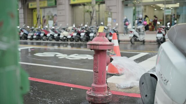 New Taipei City, Taiwan - January 29, 2021: Water comes out of the fire hydrant to lower the water pressure for maintenance purposes.
