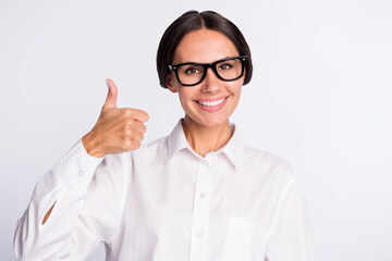 Photo of optimistic brunette hairdo lady show thumb up wear shirt isolated on grey color background