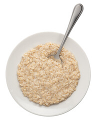 oatmeal porridge in a plate with a metal spoon.