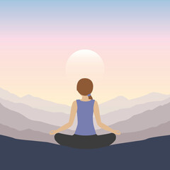 girl makes yoga on mountain landscape at sunset