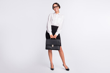 Full size photo of optimistic brunette hairdo lady stand wear spectacles shirt skirt isolated on...