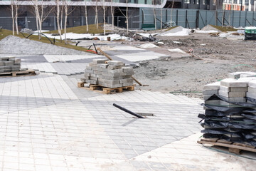 Repair of the sidewalk. Worker stonemason repair the sidewalk for Laying paving slab