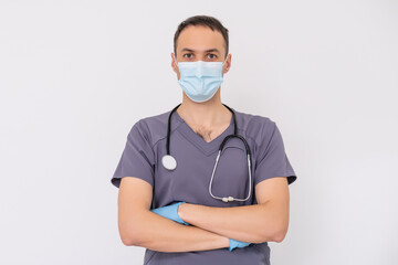 Doctor senior man, medical professional holding something in empty hand isolated over blue background