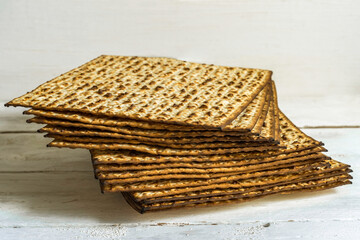 Matzah for Jewish holiday Pesach on white background .