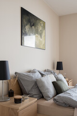 Comfortable bed with two bedside tables