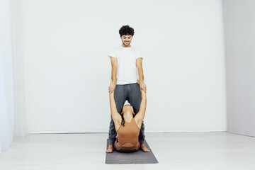 Obraz premium Male and female doubles yoga asana gymnastics fitness