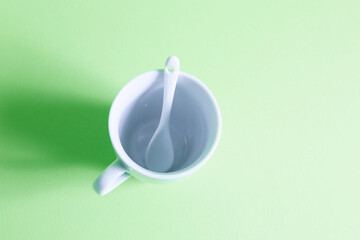 white cup with spoon