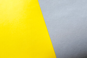 empty illuminate yellow and grey paper background. colour trend of the year 2021