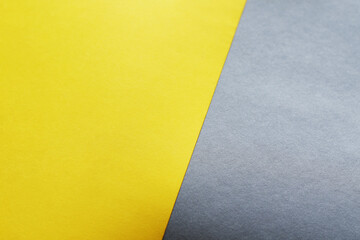 empty illuminate yellow and grey paper background. colour trend of the year 2021