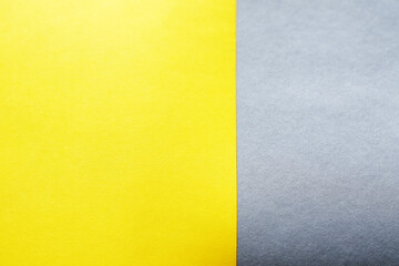 Fototapeta premium empty illuminate yellow and grey paper background. colour trend of the year 2021