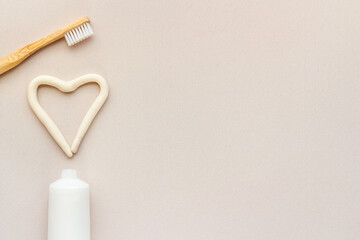 Bamboo toothbrush with toothpaste, overhead view.Dental hygiene concept