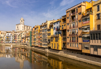 Fototapeta na wymiar the historic old city center of Girona in northern Spain with ist many colorful buildings along the banks of the Onyar River