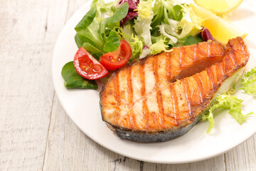 fried salmon steak and salad