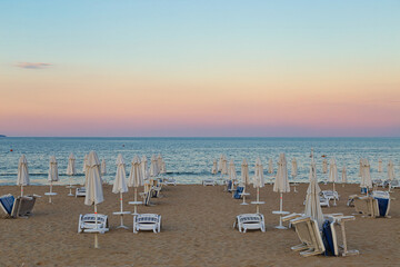 morning , sunbeds and parasols on the beach,