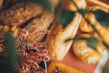 Gold rustic crusty loaves of bread and buns. Bakery concept.