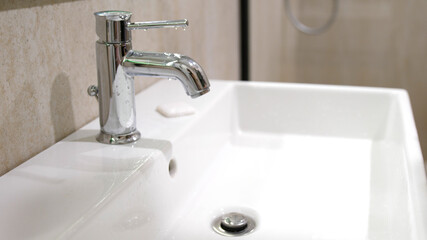 white sink and faucet. Bathroom interior