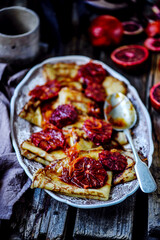 crepe suzette with bloody oranges .selective focus.