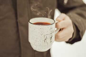 person holding a cup of coffee