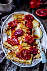crepe suzette with bloody oranges .selective focus.