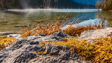 Beautiful alpine autumn or indian summer view with reflections at the famous Hintersee, Ramsau, Berchtesgaden, Bavaria, Germany