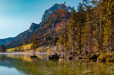 Beautiful alpine autumn or indian summer view with reflections at the famous Hintersee, Ramsau, Berchtesgaden, Bavaria, Germany