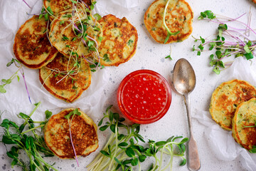 Potato pancakes with caviar.top view.style rustic