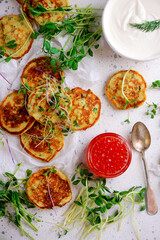 Potato pancakes with caviar.top view.style rustic