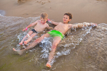 boy jumping freedom in the beach 2021 play