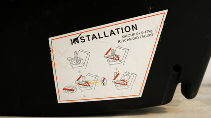Instruction guide sticker on carry cot