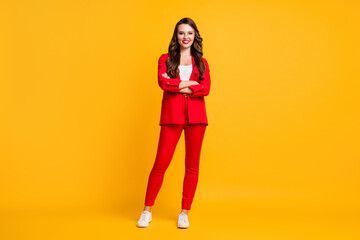Fototapeta na wymiar Full length photo of lovely fancy girl crossed arms look camera wear red blazer trousers sneakers spectacles isolated yellow color background