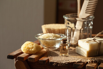 Zero waste and sustainable lifestyle concept. Eco-friendly bathroom accessories. Handmade soap, organic essential oil, sea salt, wooden background. Home body, face care. Close-up copy space for text