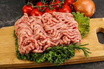 Raw pork minced meat over board