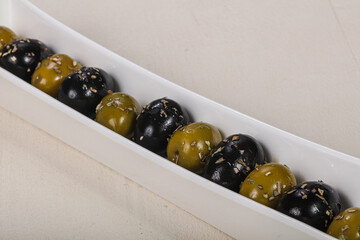 Black and green olives in the bowl