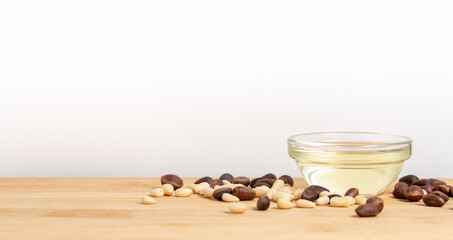 Banner, organic cosmetics concept, glass bottle with oil, cedar on light wooden background
