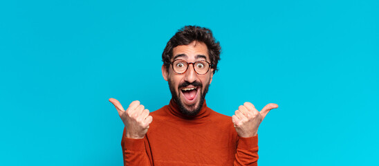 young crazy bearded man. happy and surprised expression. copy space concept