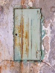 old textured and weathered green metal door