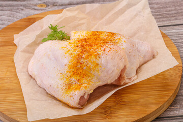 Raw chicken thigh with spices