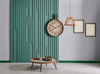Green room wall background with furniture and lamp design.