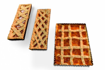 Rustic tart pie with jam, three traditional Italian homemade cakes in the baking tray, isolated on white background