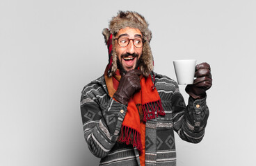 young crazy bearded man. happy and surprised expression. thinking or doubting expression and...