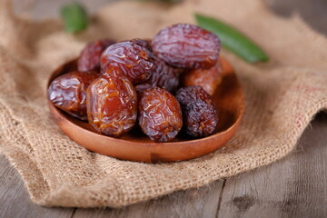 dry dates fruits on wooden table