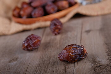 dry dates fruits on wooden table