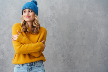 Portrait of a happy young girl dressed in winter clothes