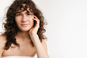 Fototapeta premium Half-naked curly woman posing and looking at camera