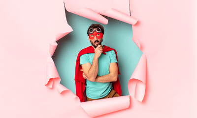 crazy  super hero man. thinking or doubting expression