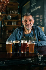 barman serving beer in pub