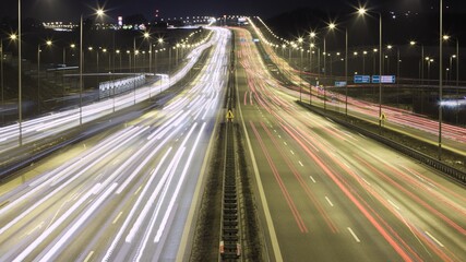 Fototapeta na wymiar Time lapse night traffic on highway