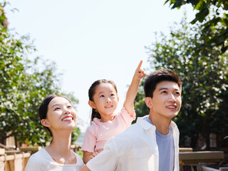 Happy family of three in the outdoor group photo