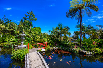 Monte Palace - Tropical Garden with Waterfalls, Lakes and traditional buildings above the city of...