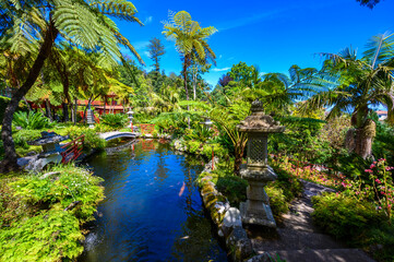 Monte Palace - Tropical Garden with Waterfalls, Lakes and traditional buildings above the city of...